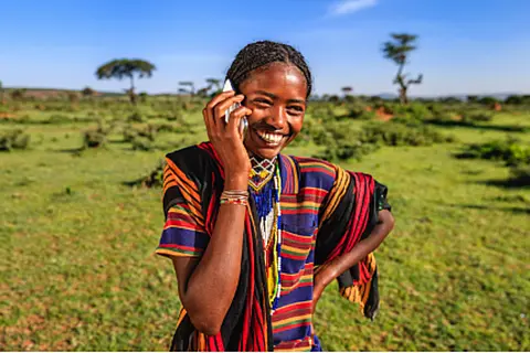 woman in ethiopia conducting business on cellphone