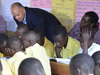 Paul Weisenfeld observes a classroom of students in Uganda