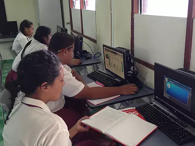 Students in Samoa work in a school computer lab.