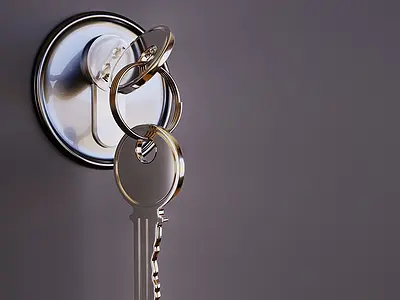 Closeup of a set of keys in a lock.