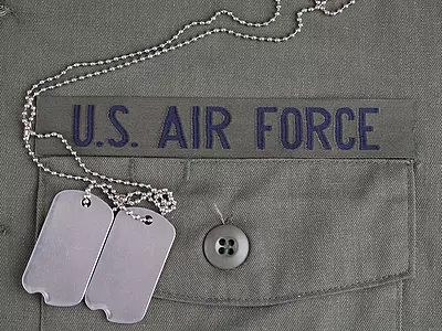Closeup of an Air Force uniform with dog tags.
