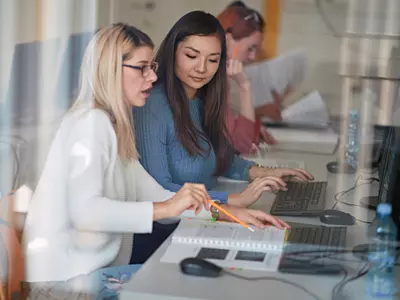 Women collaborating at a computer