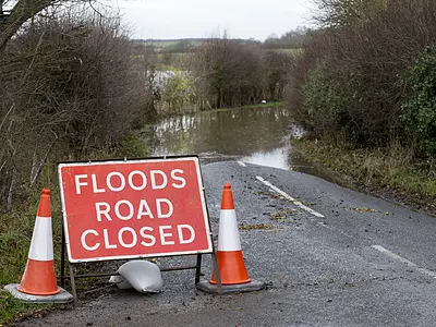Flooded road with road closed sign