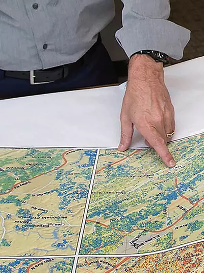 our GIS experts examine large-format maps