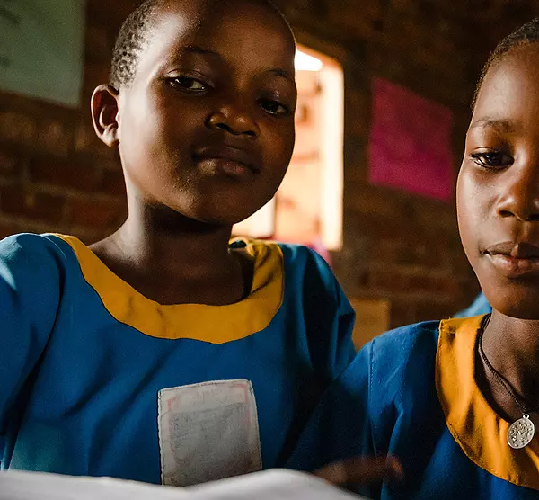 Ugandan students participate in reading class