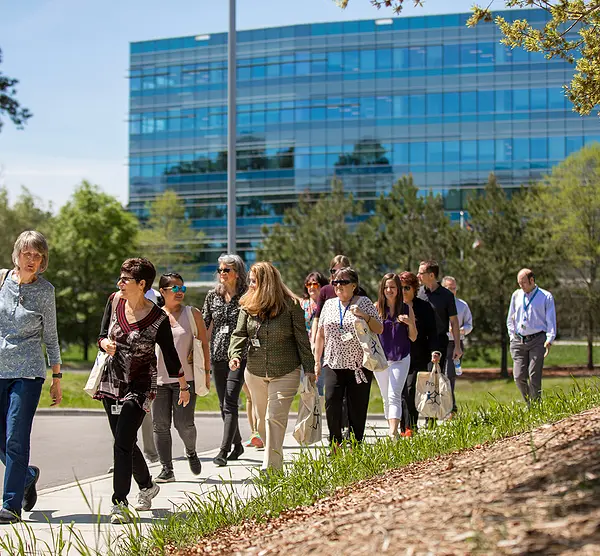 RTI employees walk around the RTP campus during a wellness event.