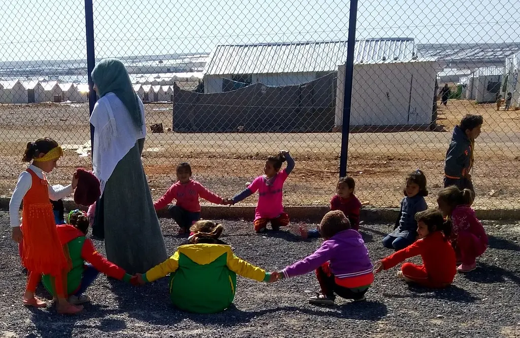 children playing at a refugee camp in Jordan