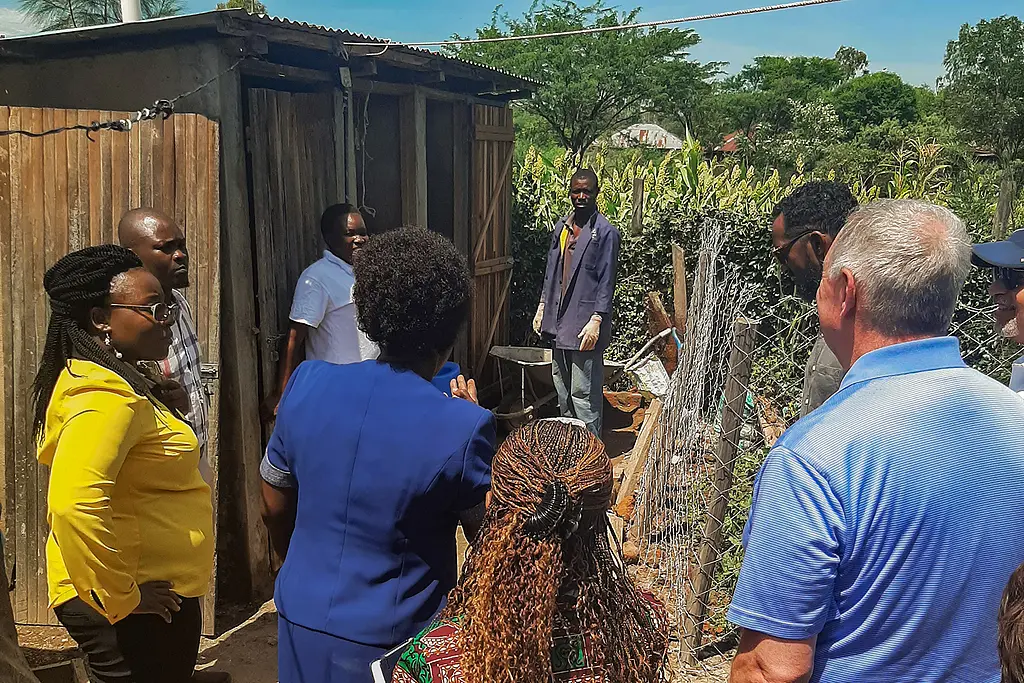 RTI visitors hosted in Kisumu, Kenya by homeowner Dorothy Oketch for the installation of her new toilet facilities, June 2023