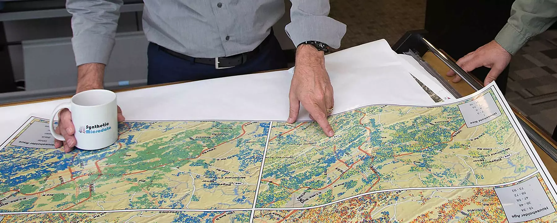 our GIS experts examine large-format maps