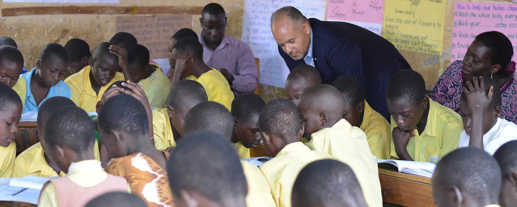 Paul Weisenfeld observes a classroom of students in Uganda