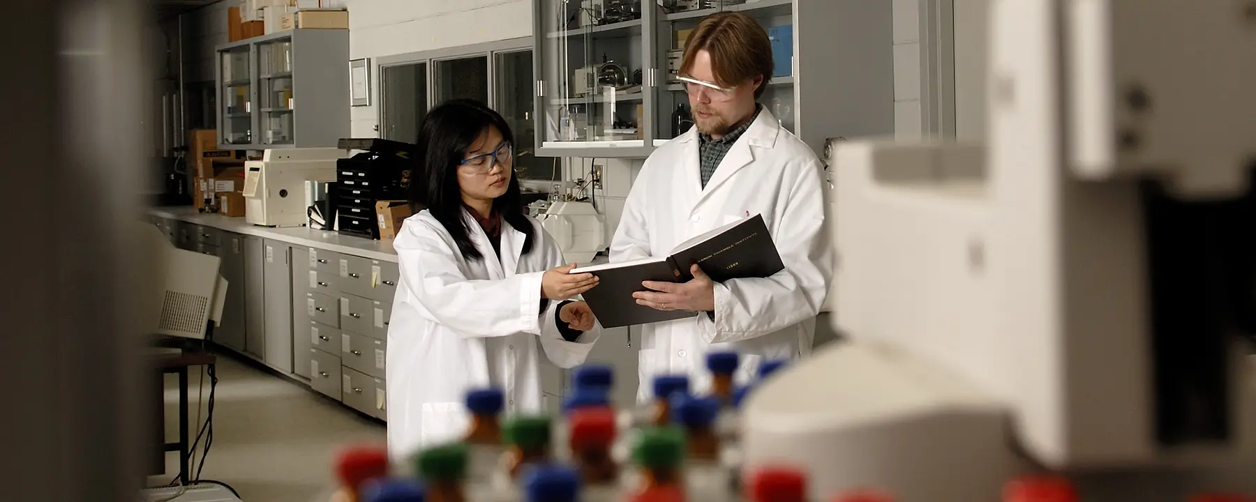 Researchers in a lab working on polymeric material