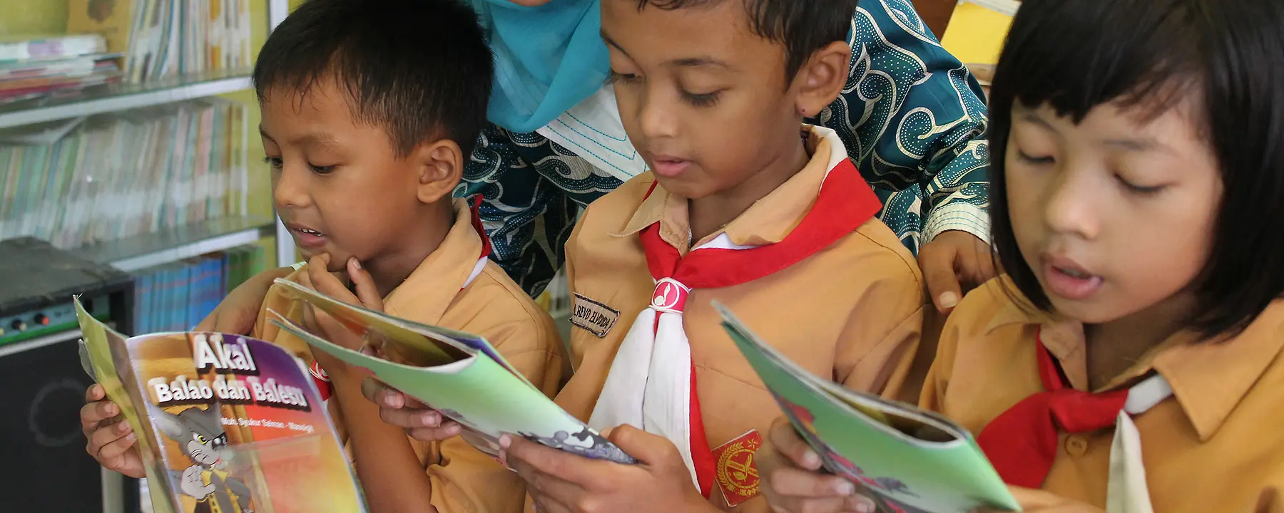 Children reading books in Indonesia