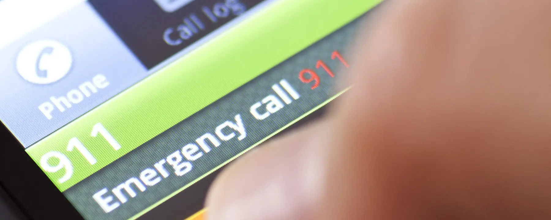 A closeup of someone dialing 911 on a smartphone