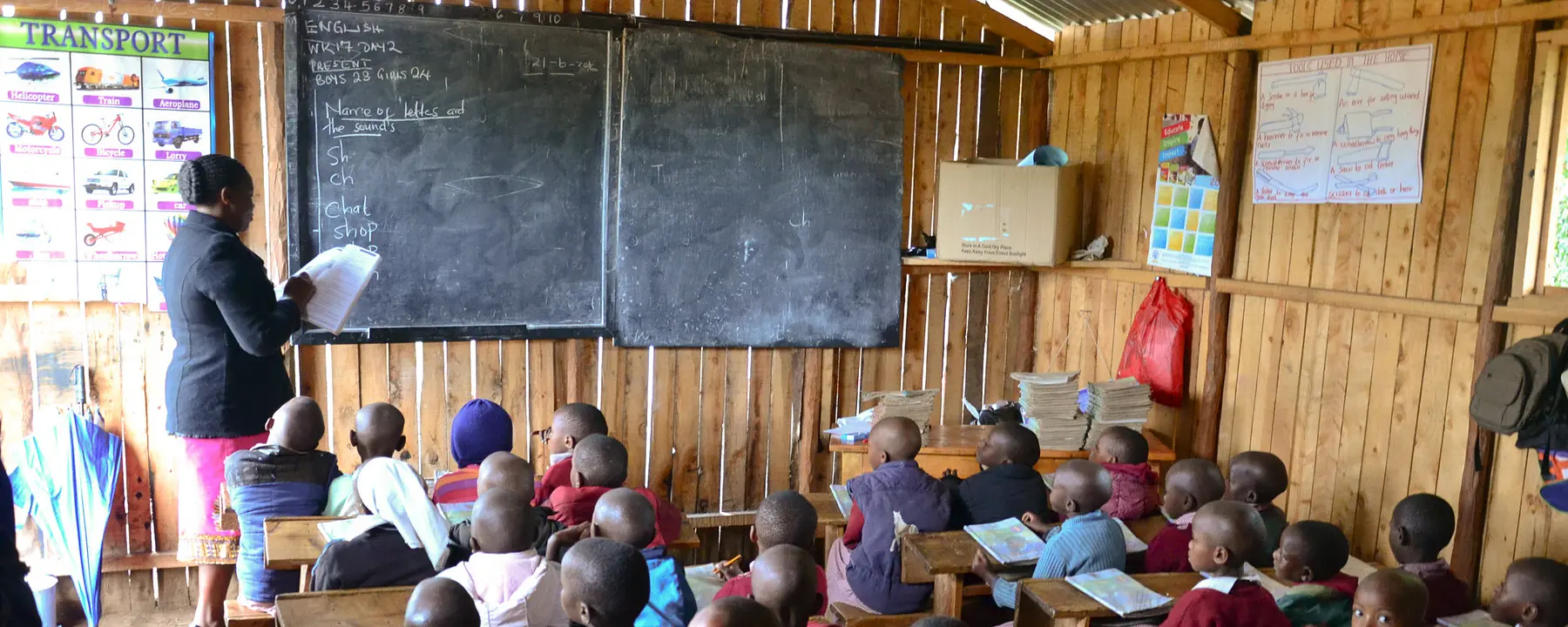 Teacher in Kenya leads a reading lesson