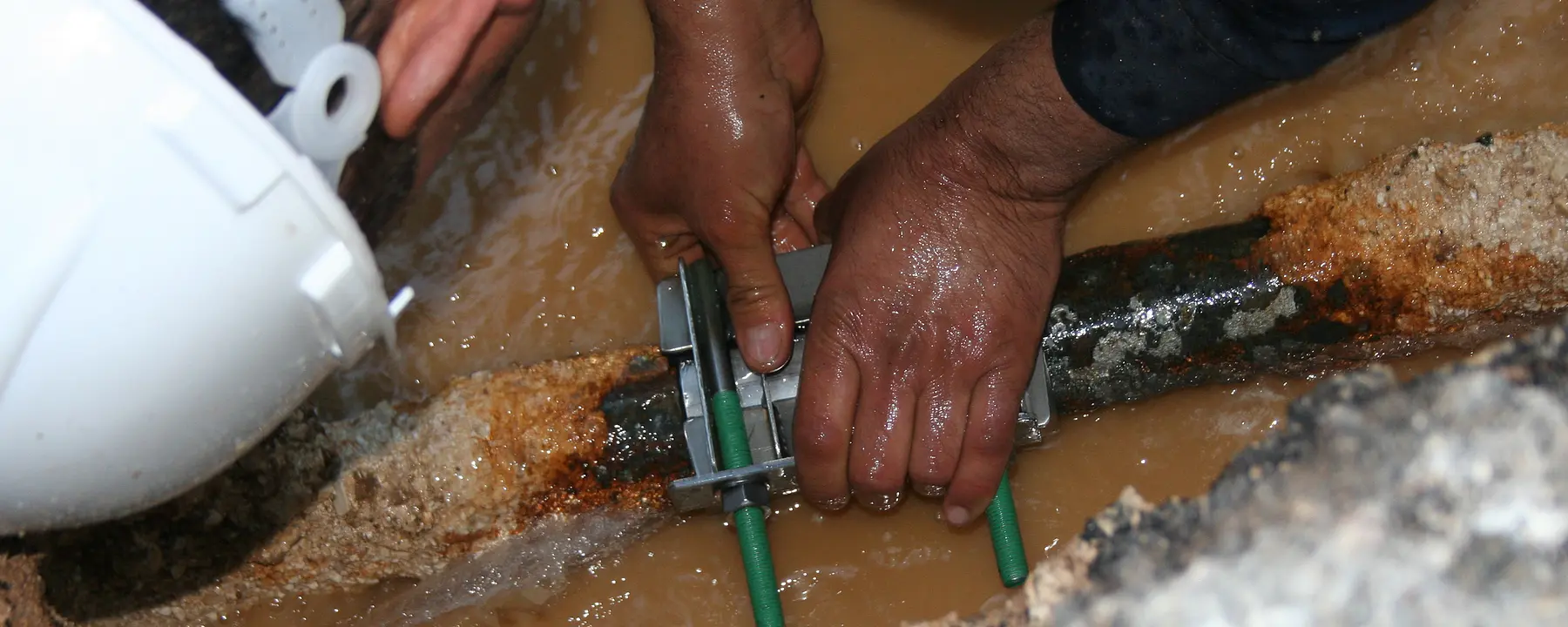 A man works on a water main in Jordan.