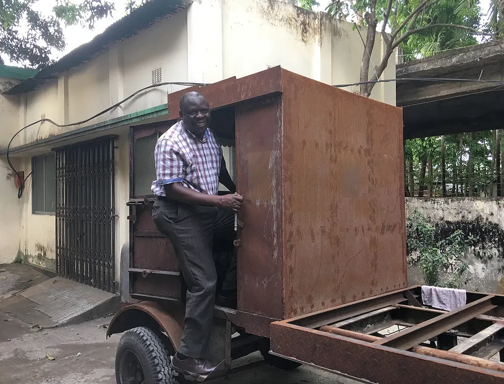 Dennis Mwanza, an RTI sanitation expert originally from Zambia, drives an emptying truck.
