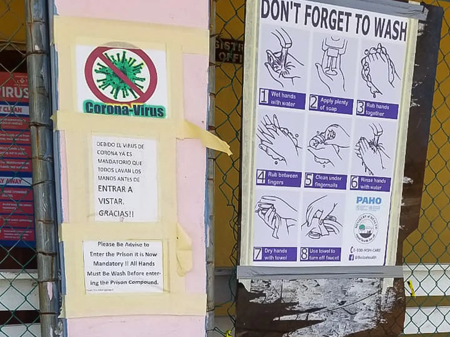A sign at the Belize Central Prison reminds visitors to wash their hands to help prevent COVID-19.