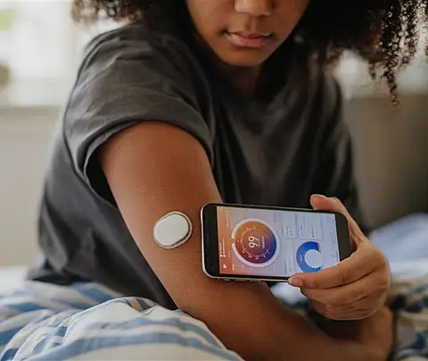 Young woman measures her blood sugar