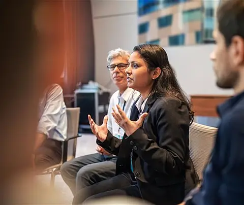 Woman speaks in small group
