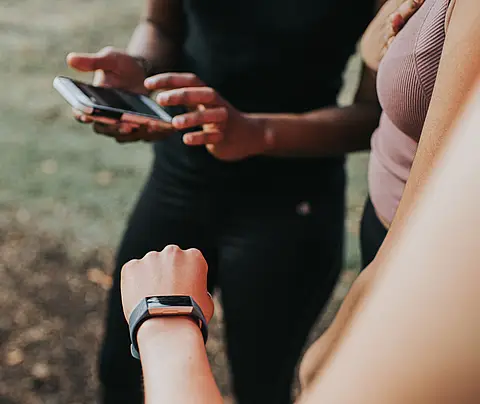 Person checking wearable watch