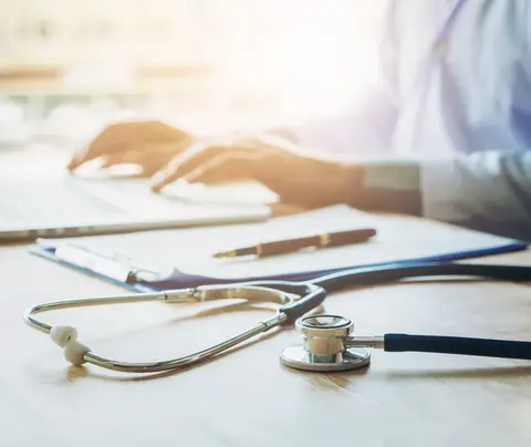 Doctor working on laptop