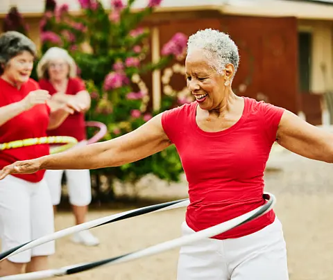 Elderly woman in exercise group