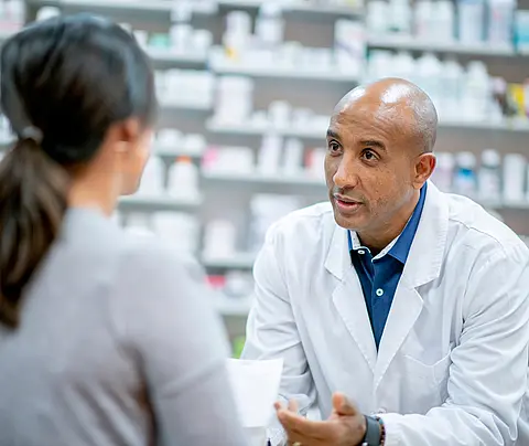 Pharmacist speaks to patient