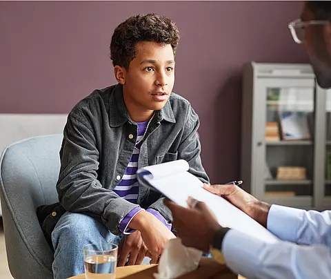 Young person consults with doctor