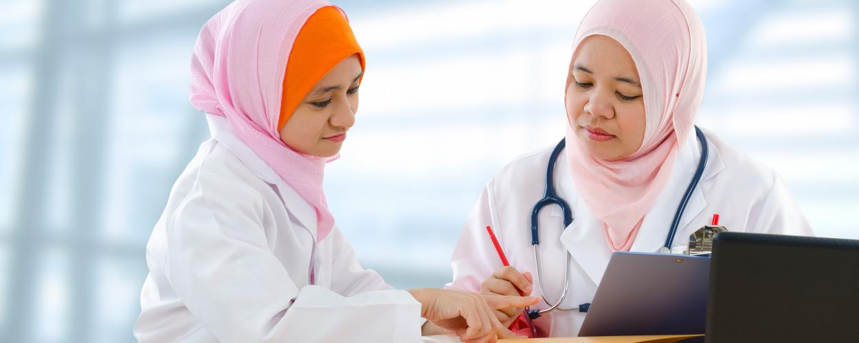 Doctor and nurse compare notes