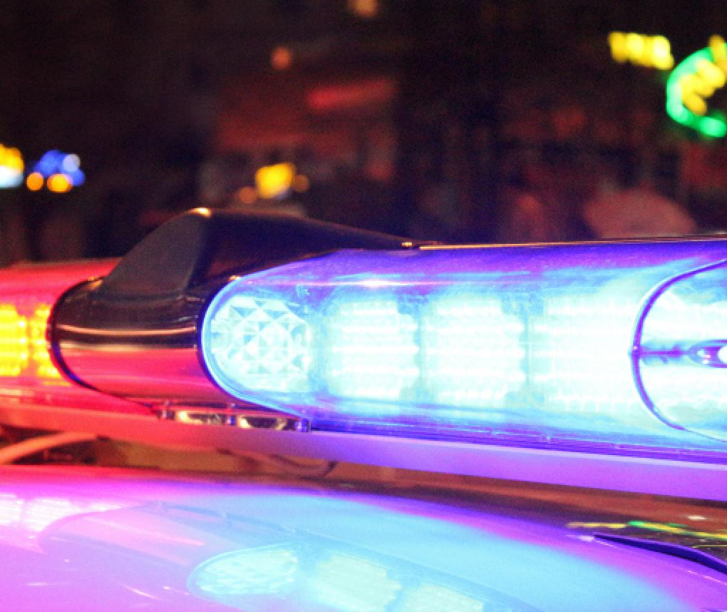 Police lights flashing at night